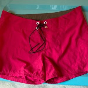 Lole’ shorts for women. Size 10. Red with leather lace-up accent.